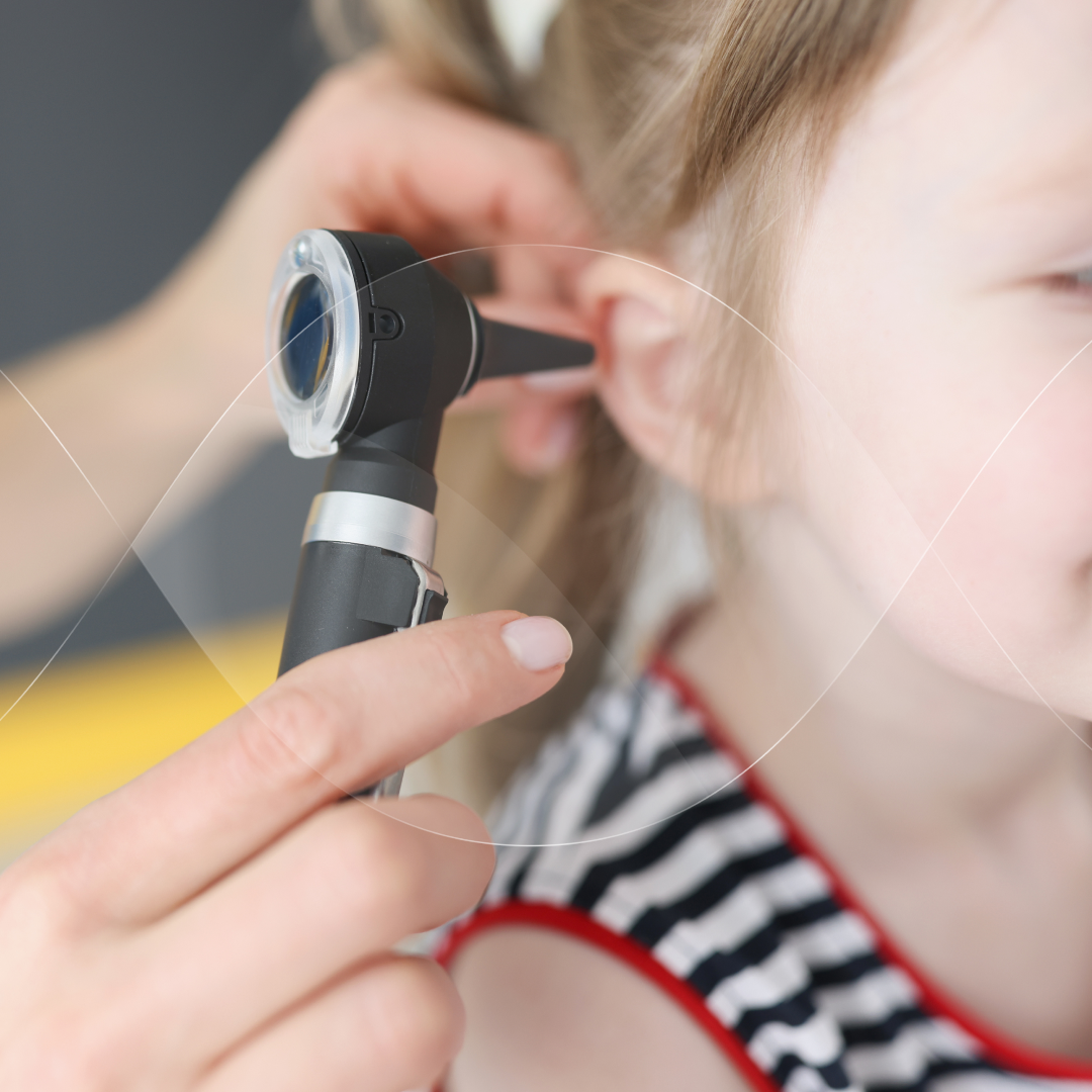 Examining ears of a child